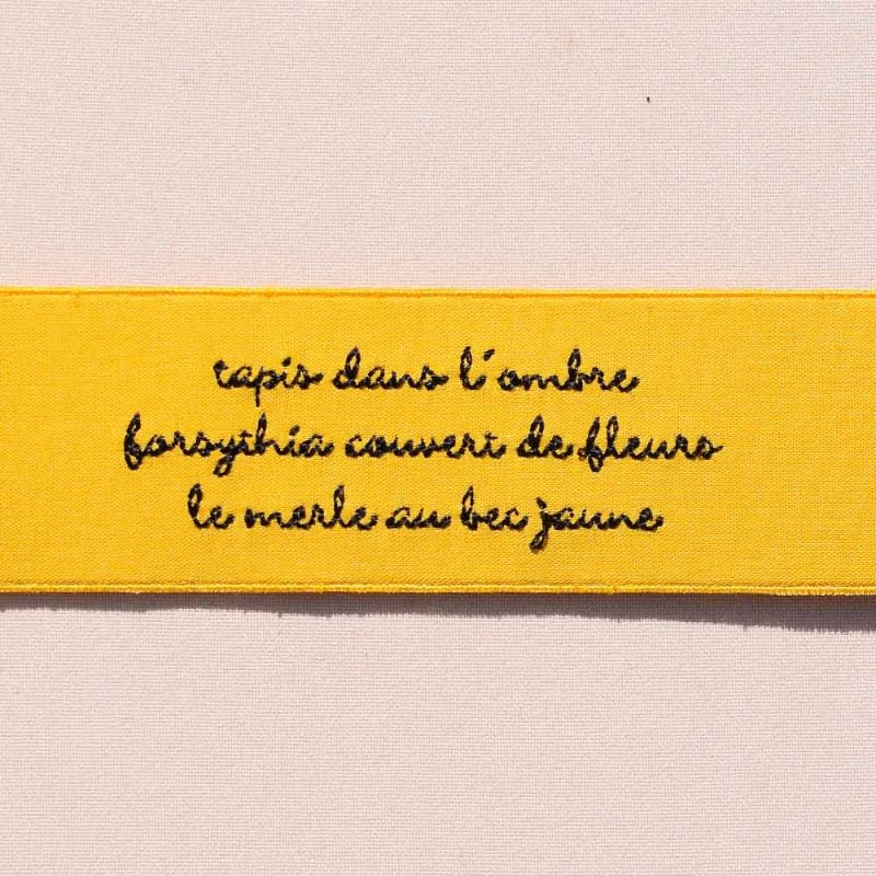 Le forsythia et le merle – Haïku